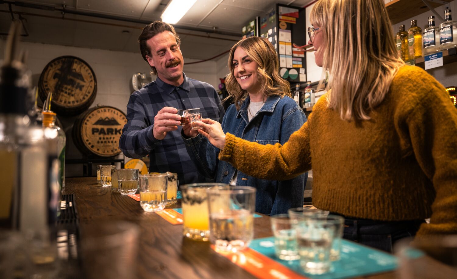 Three people trying gin during the Blend your Own Gin experience at PARK Distillery.